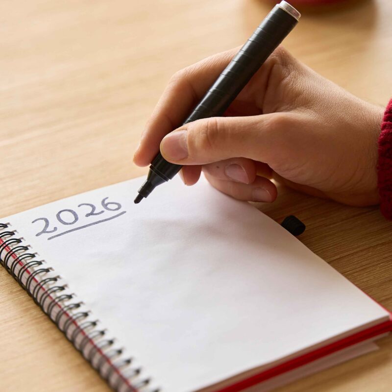 Image showing someone writing New Year's Resolutions