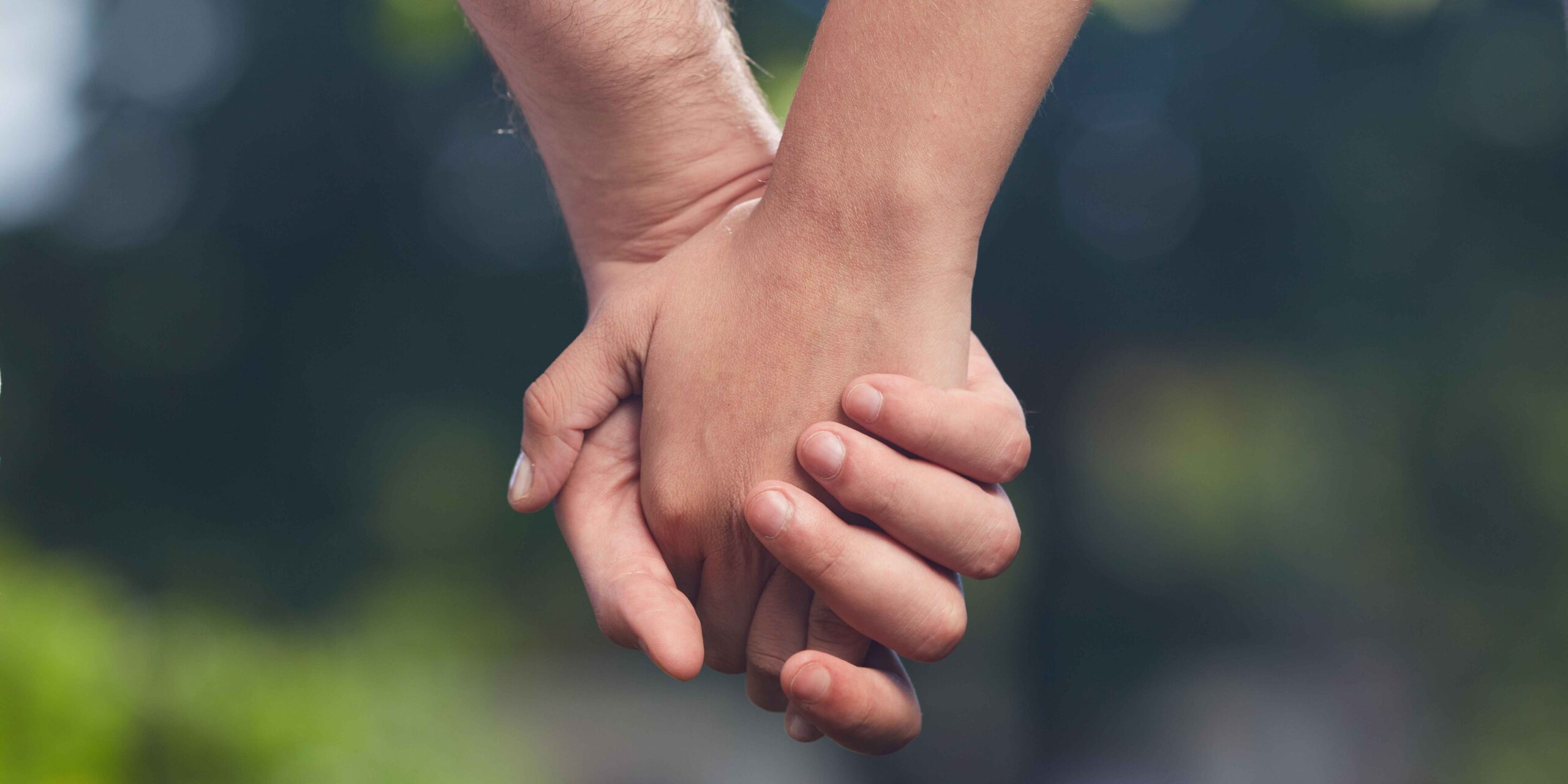 Holding hands to show a healthy relationship
